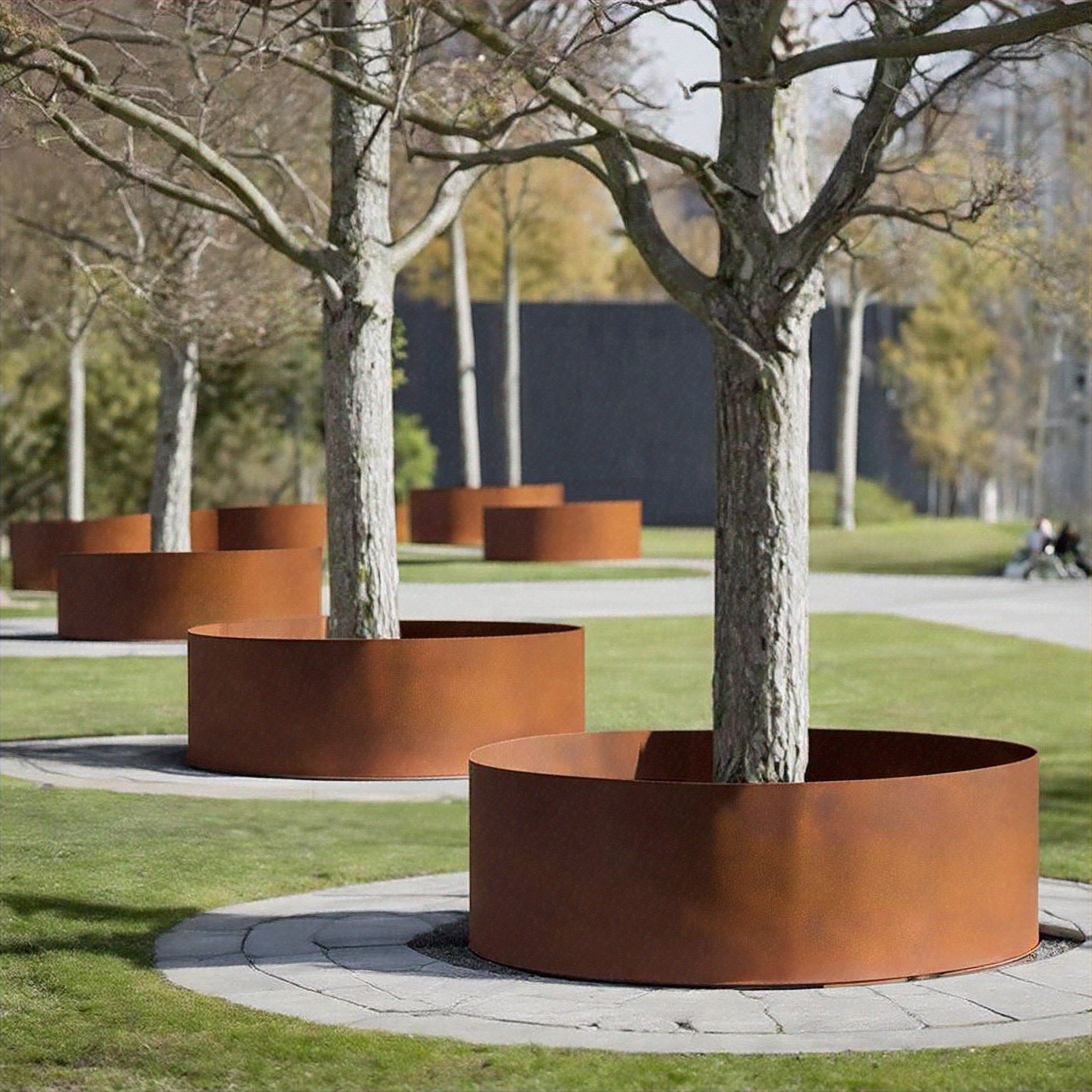 corten planter rings around trees